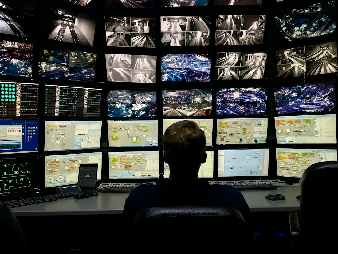 Team monitoring live dashboards and camera feeds